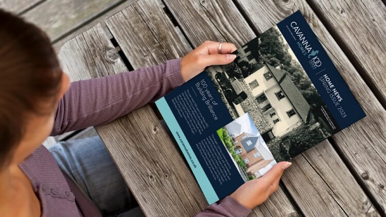 Picture of a person reading the latest issue of Home News