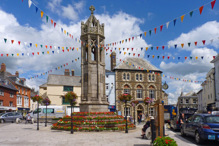 Launceston war memorial in the town centre, with bunting hanging from it