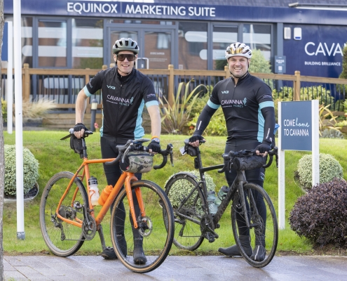 Ben Rowntree and Michael Newman cycling through Cavanna Homes' Equinox development.